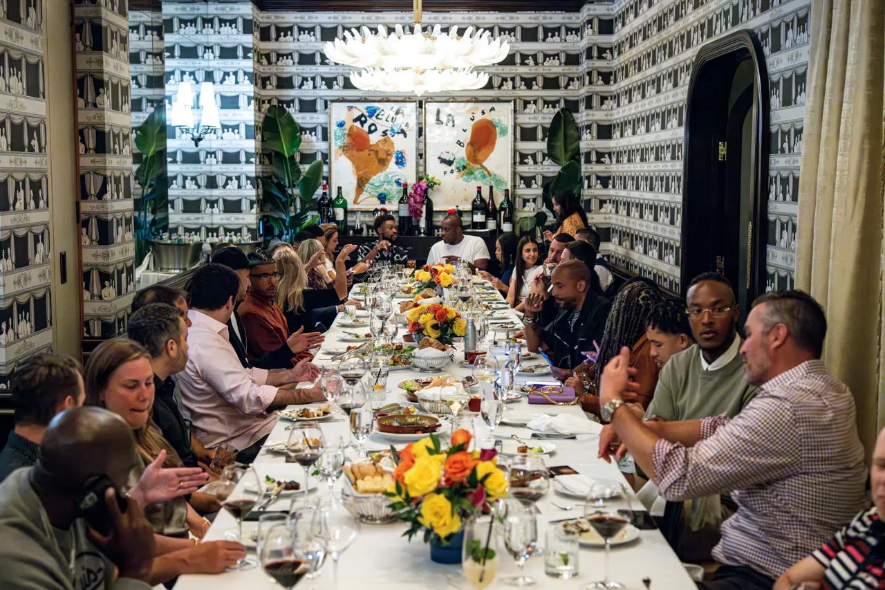Private dining room with guests seated at a long table