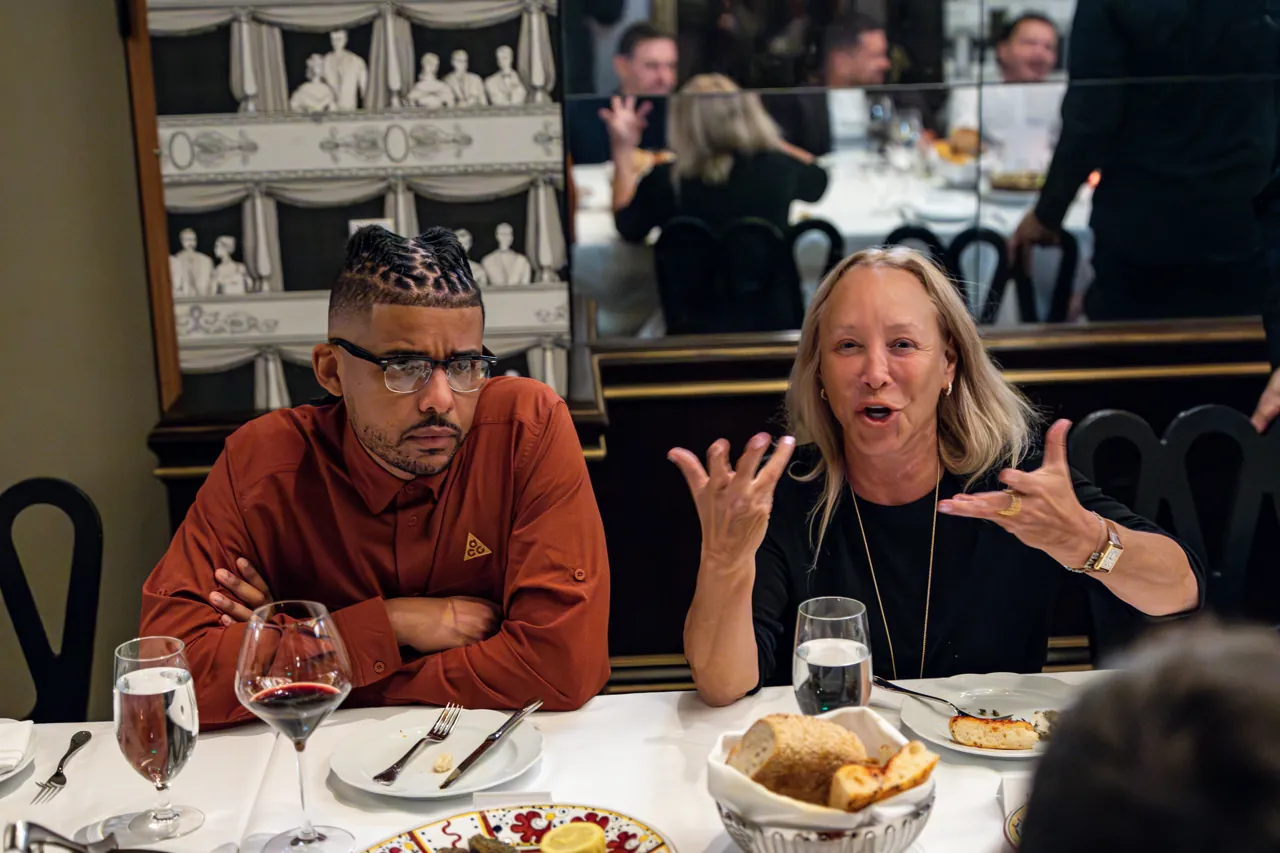 Guests in conversation over dinner