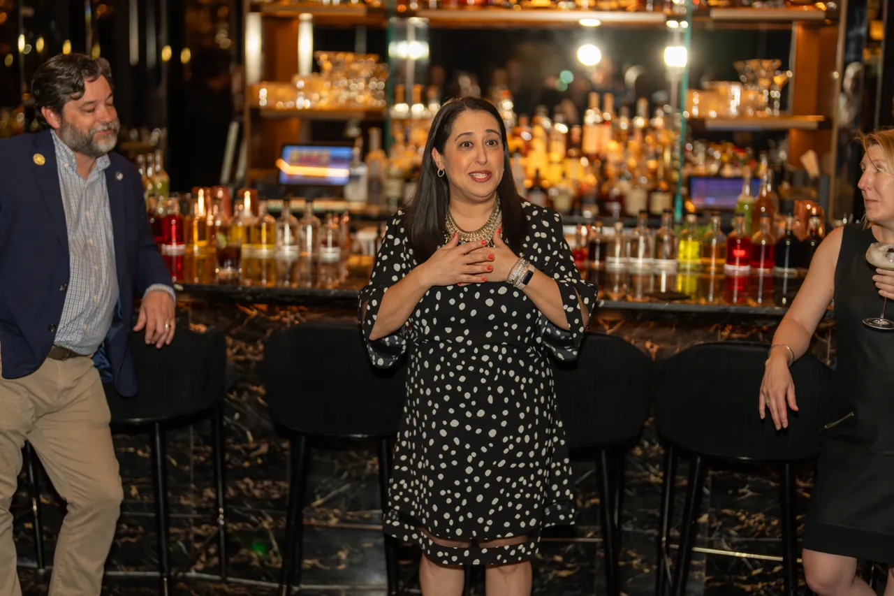 Host welcoming guests at a reception