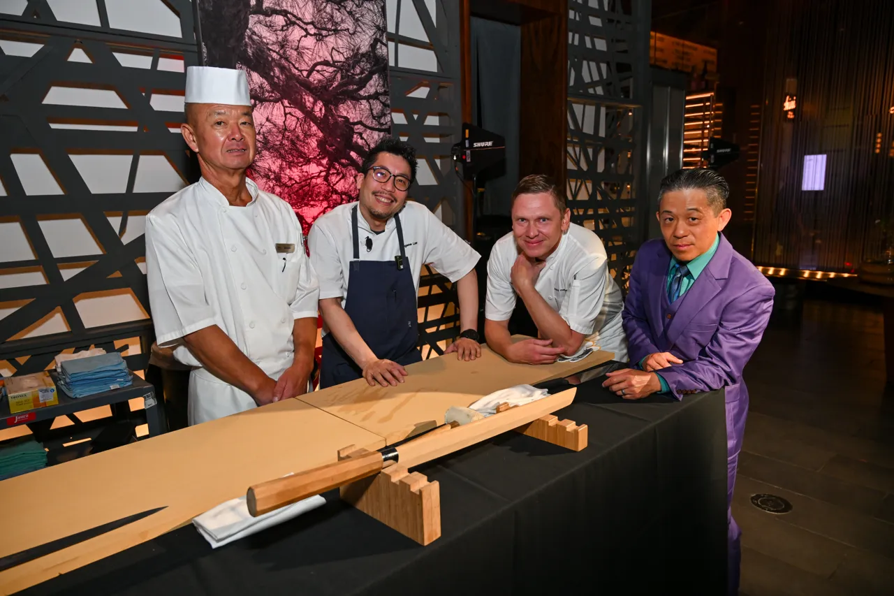 Chefs and guests gathered at the preparation counter — Morimoto, Las Vegas