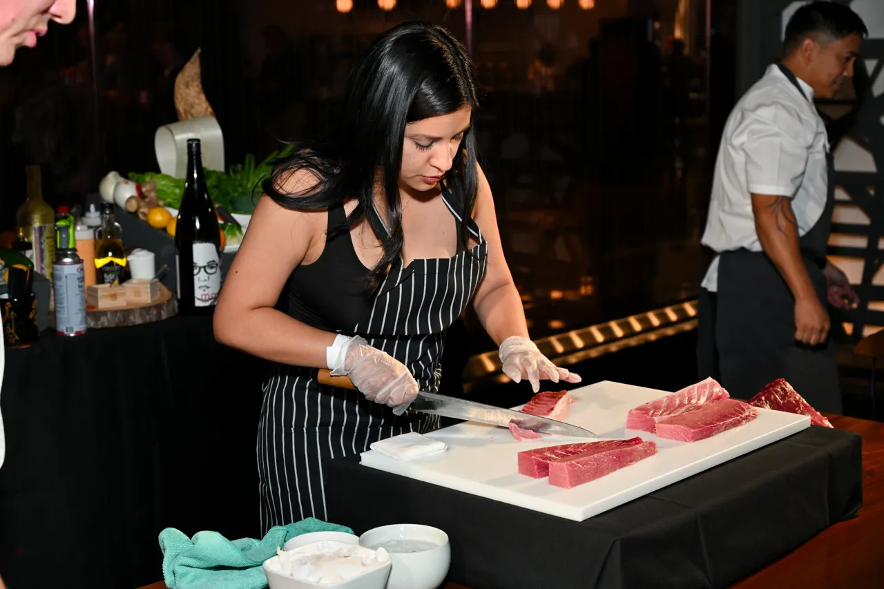Guest learning knife skills during the culinary event — Morimoto, Las Vegas