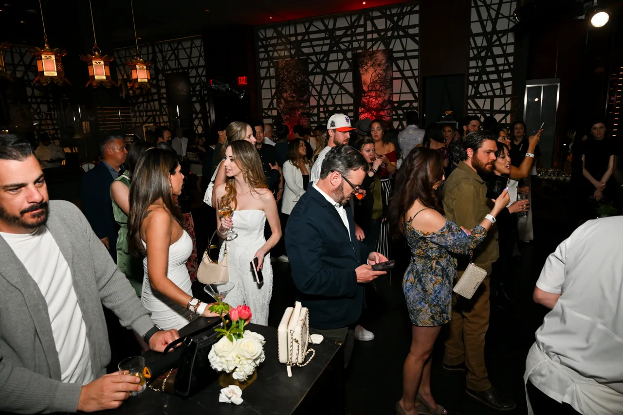 Guests gathered around the chef demonstration — Morimoto, Las Vegas