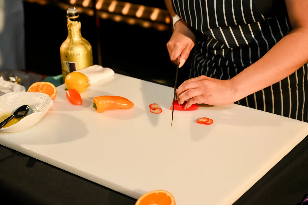 Chef preparing a plated dish — Morimoto, Las Vegas